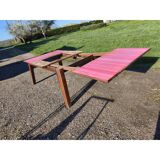 1960s oak dining table with integrated extensions.