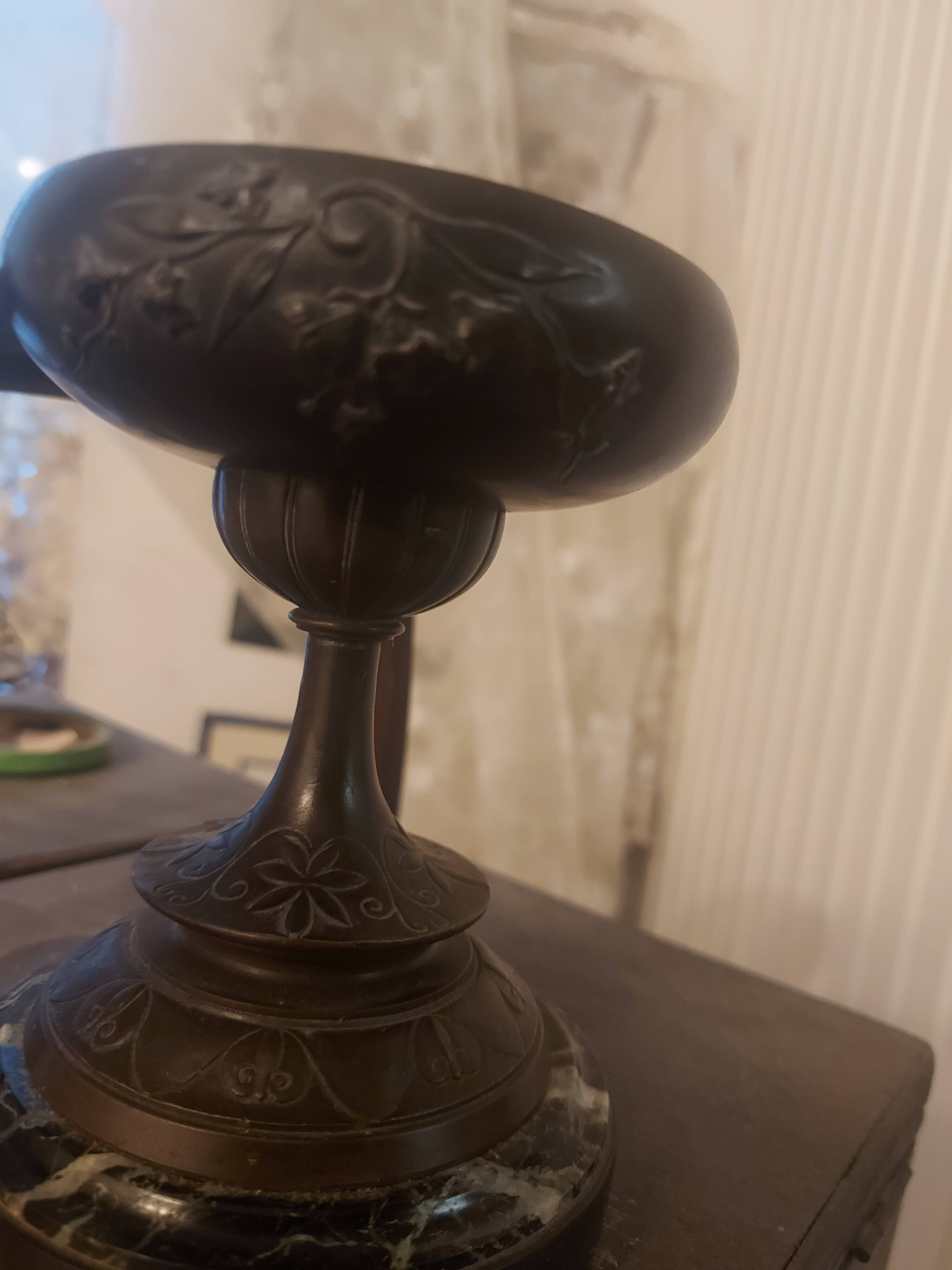 Bronze bowl on marble base