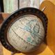 Pair of greenhouses vintage wooden books world map