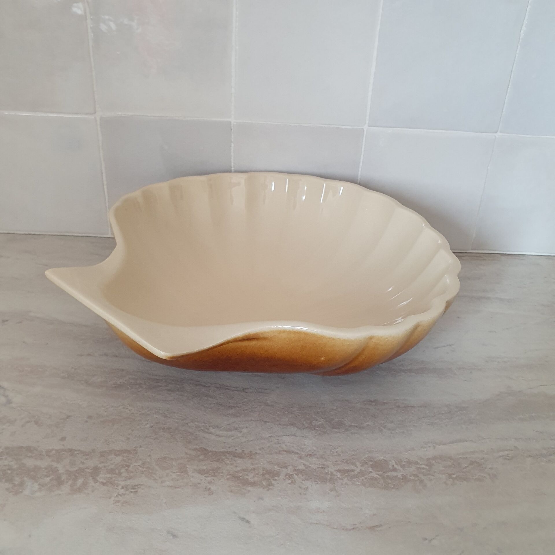 Brown and white ceramic shell bowl