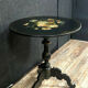 Guéridon NAPOLÉON III in blackened wood resting on a tripod foot.