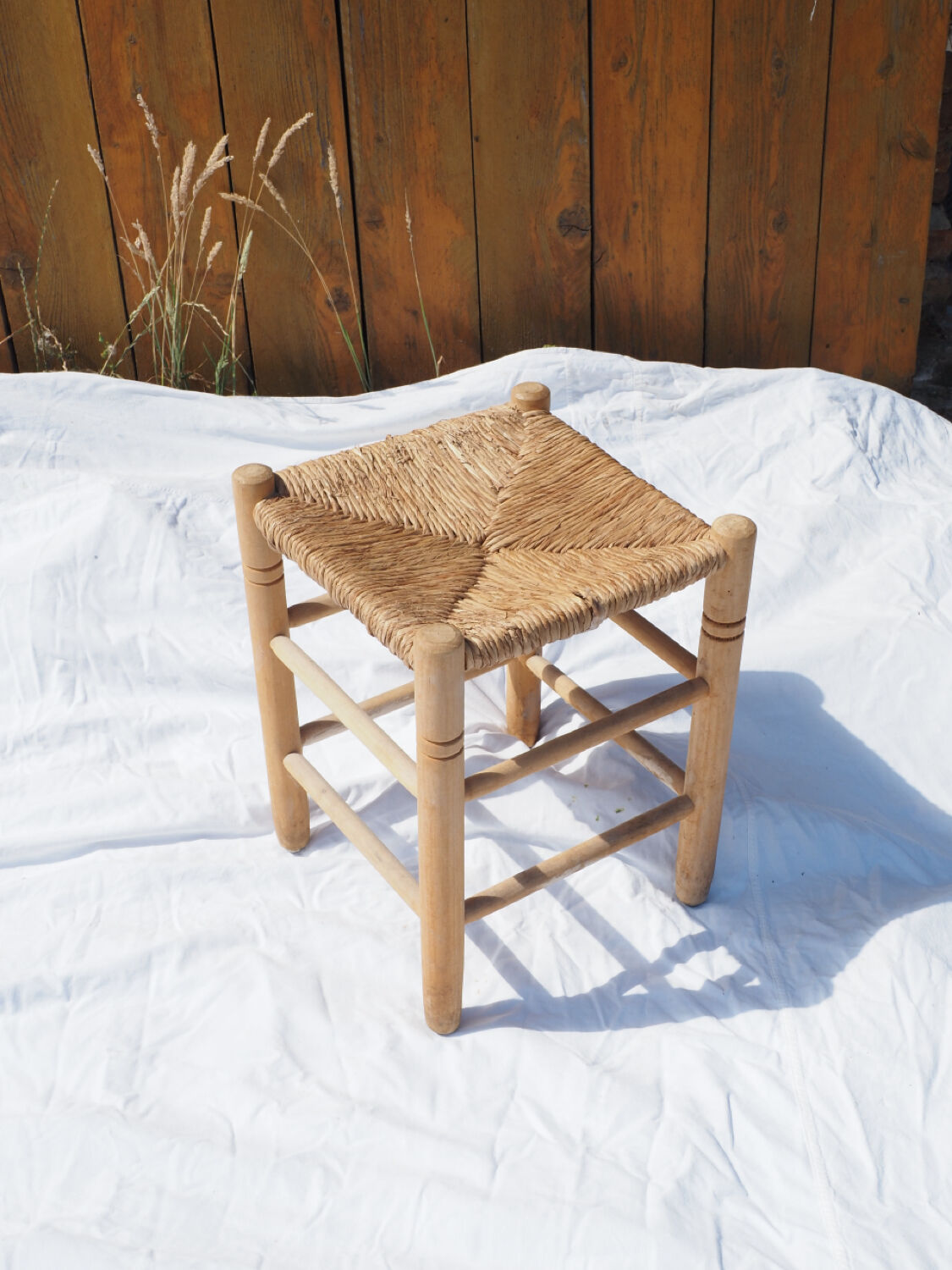 Farm stool made of wood and straw
