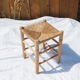 Farm stool made of wood and straw