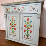 Antique low polychrome sideboard with floral decoration.