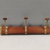 Danish teak and brass coat rack with adjustable hooks, 1960s.