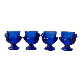 4 chicken-shaped egg cups in cobalt blue glass