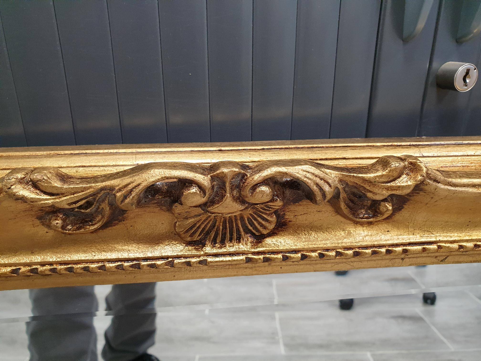 Beveled mirror and golden wood