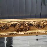 Beveled mirror and golden wood