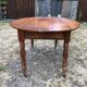Louis Philippe oval drop-leaf table in solid cherry wood with 2 drawers.