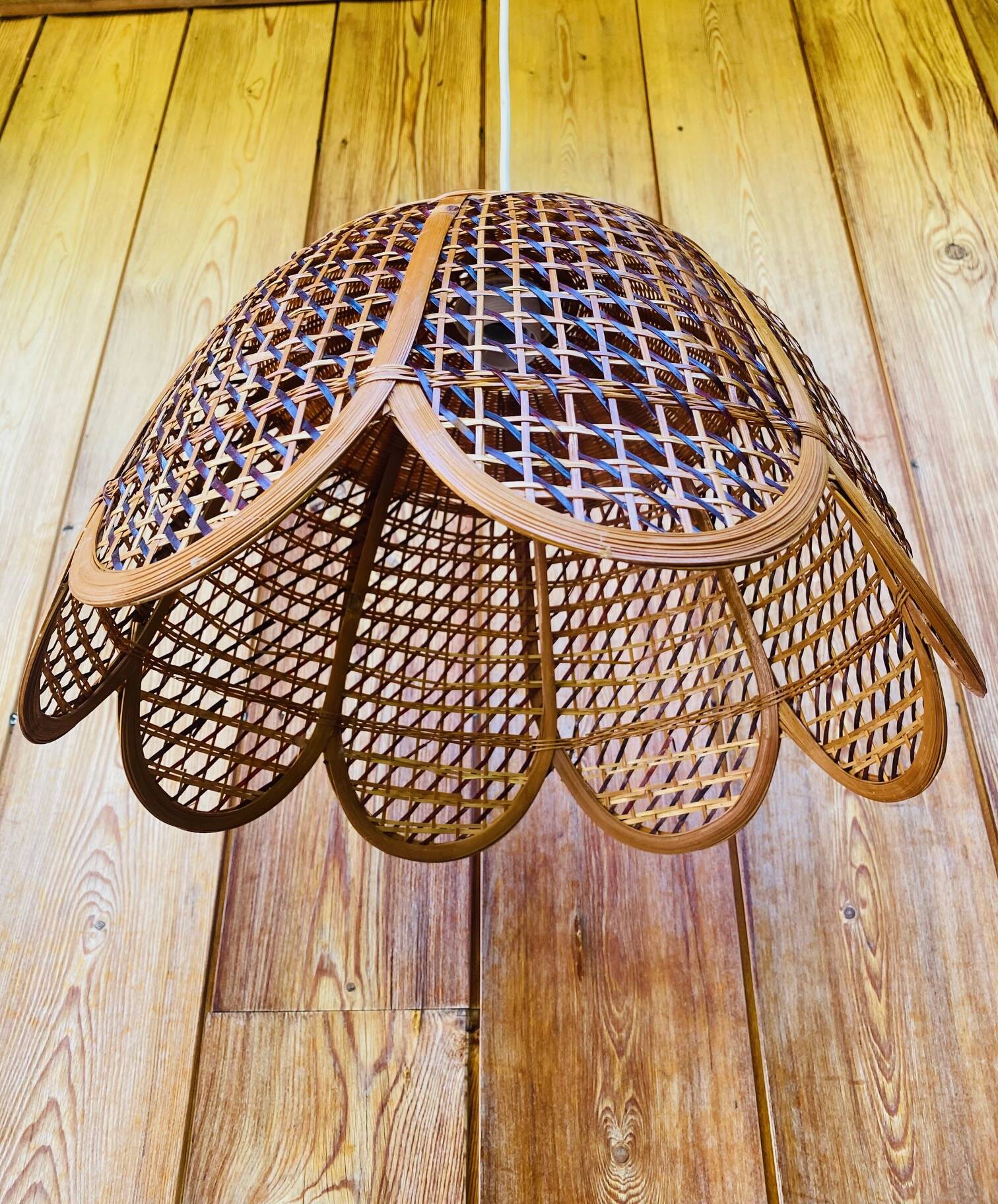 Rattan and cane lampshade in the shape of a flower from the 1970s.