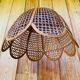 Rattan and cane lampshade in the shape of a flower from the 1970s.