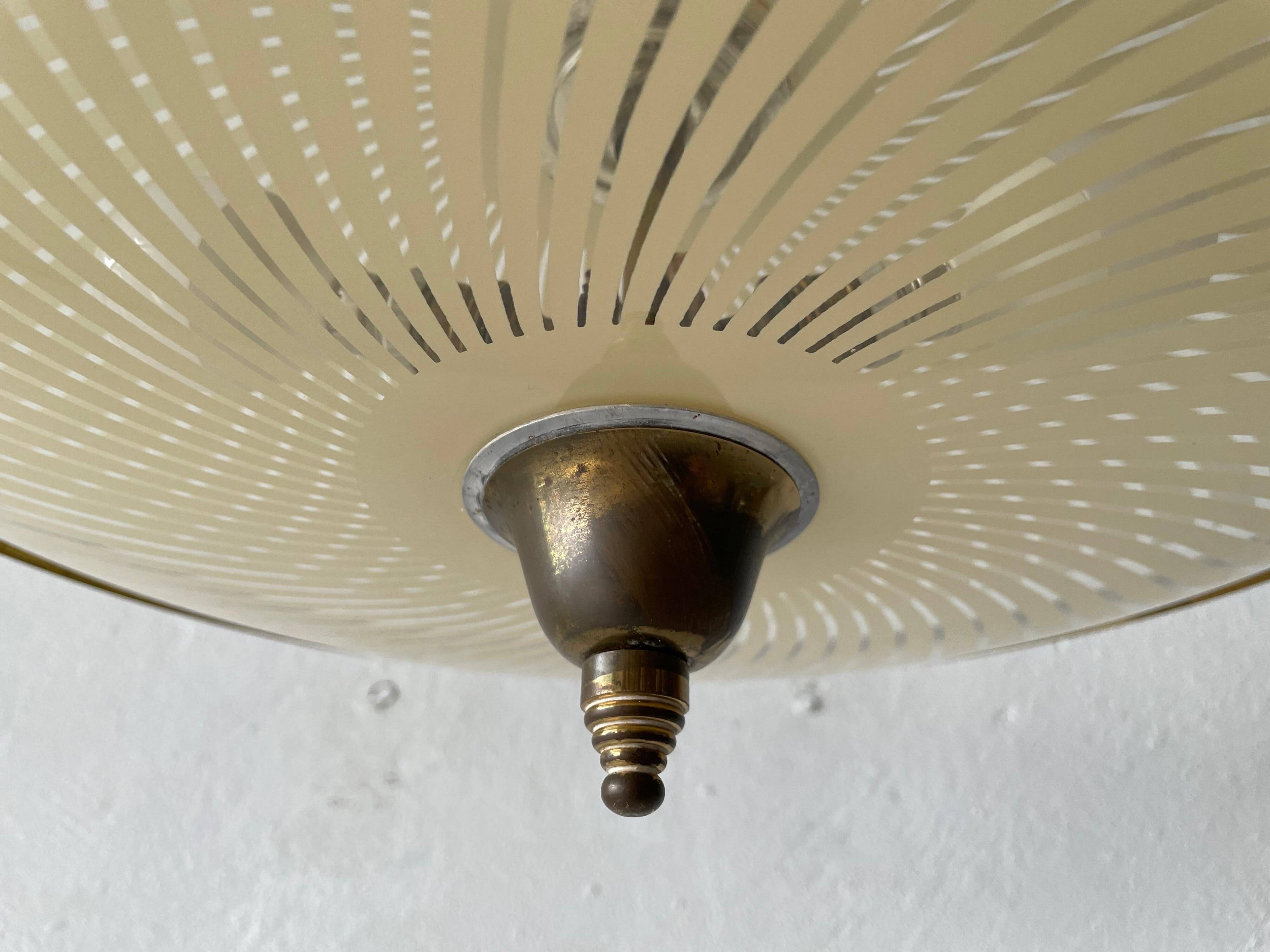 Large UFO design ceiling light in brass and printed glass, 1950s, Italy.