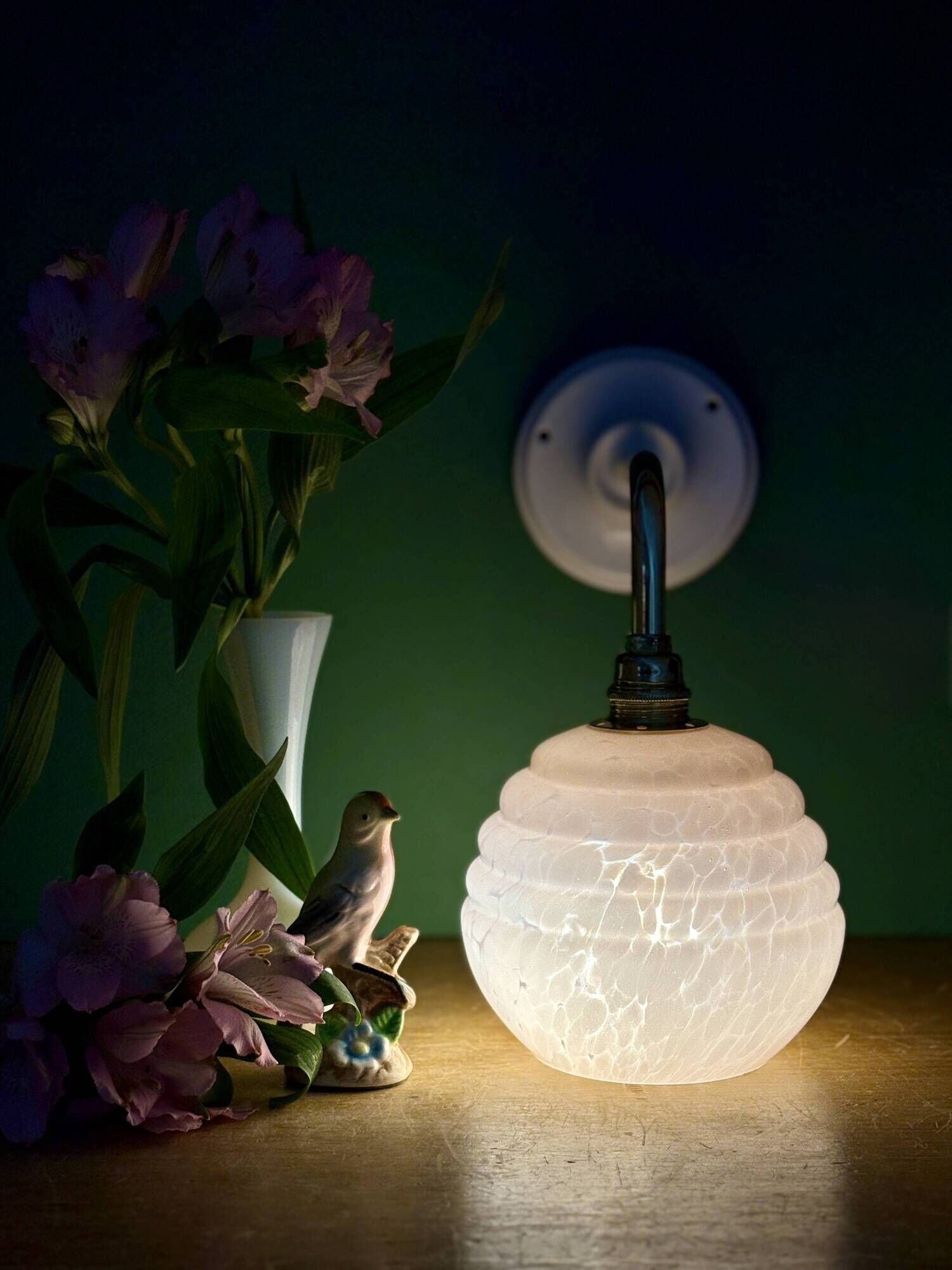 Vintage pink Clichy glass globe wall light.