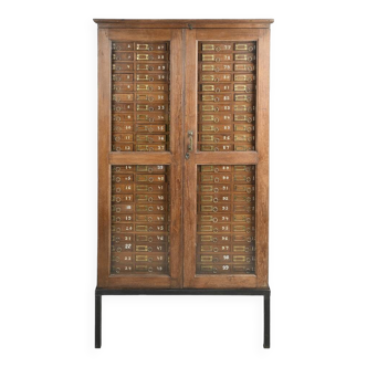 Glass filing cabinet with 125 drawers