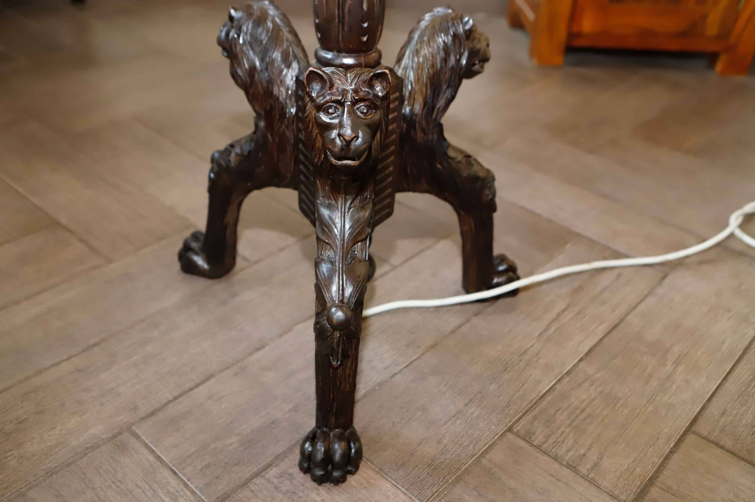 Antique floor lamp with lion motif