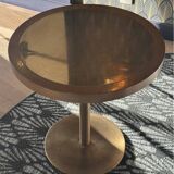 Round wooden and brass table