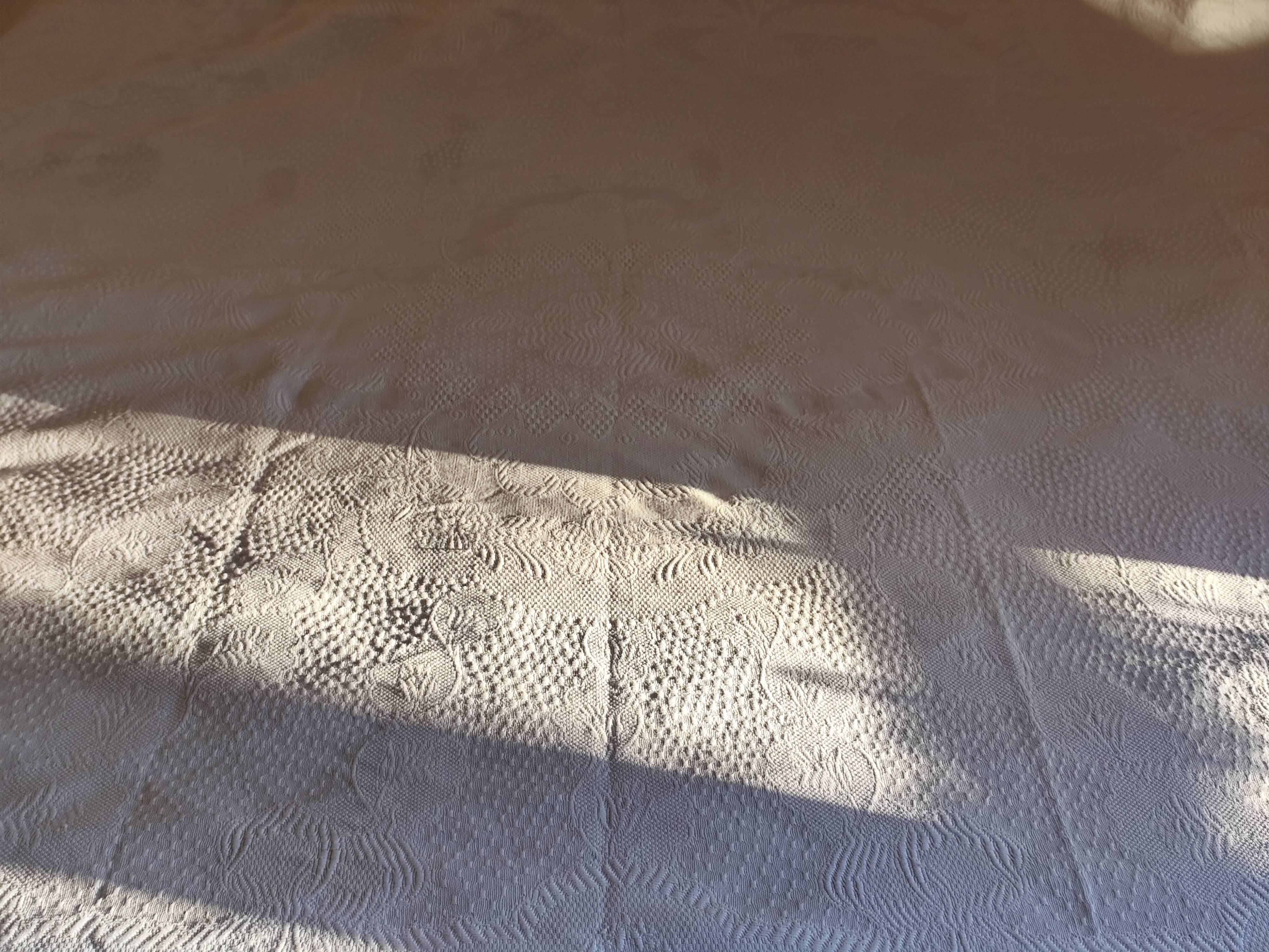 White woven cotton bedspread with fringes