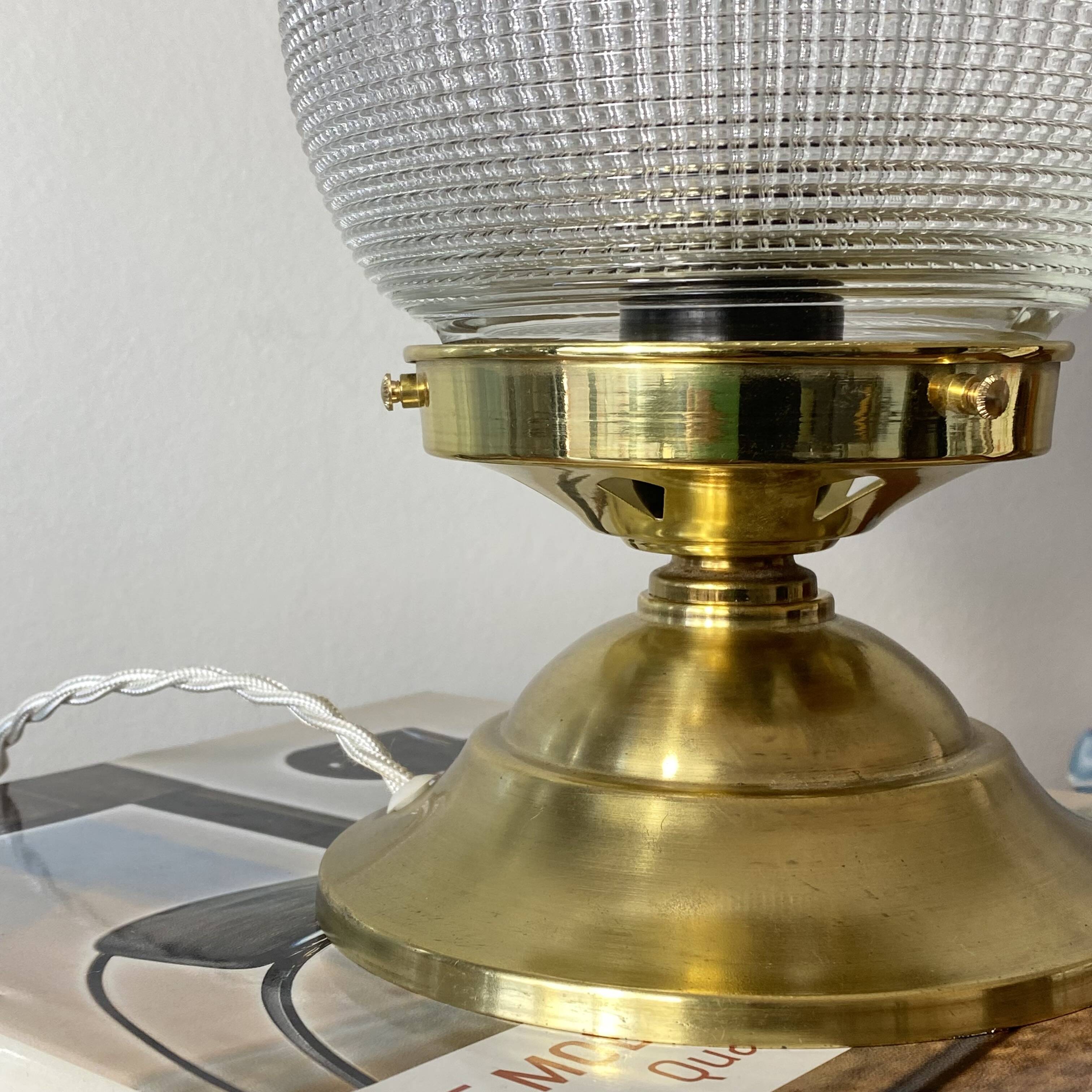 Antique globe table lamp in glass, Holophane type, and brass.