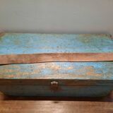 Old wooden trunk with blue patina