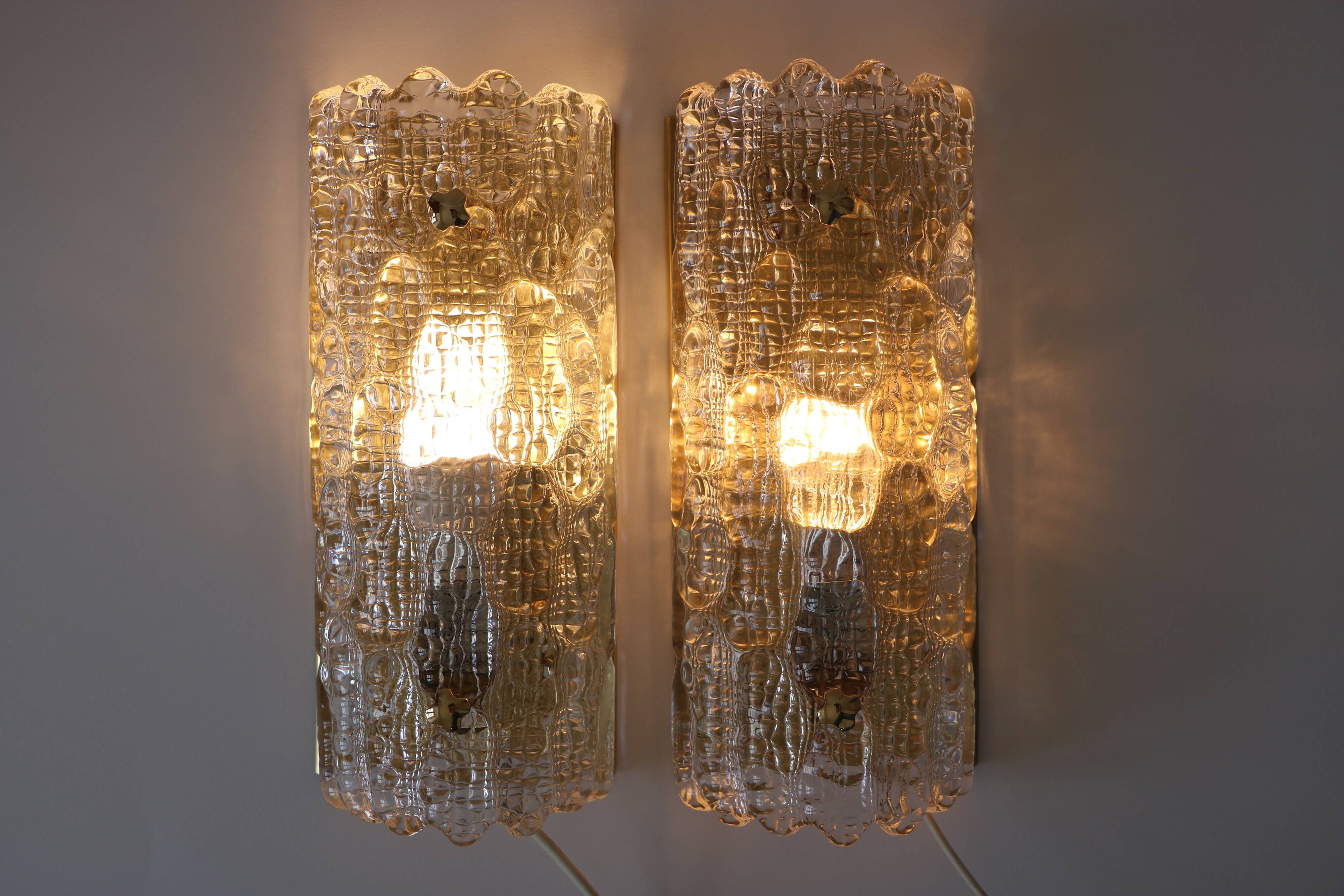 Pair of glass and brass wall lights by Carl Fagerlund for Orrefors.