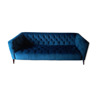 Royal blue velvet upholstered sofa