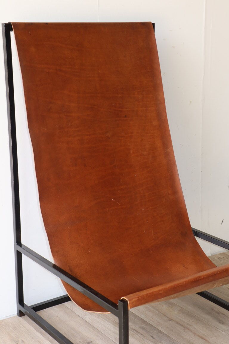 Pair of vintage armchairs in stretched leather and metal structure
