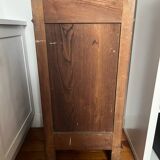 Solid wood storage furniture with a marble top.