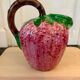 Ceramic jug in the shape of a strawberry.