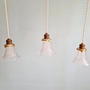 Art Deco trio of pendant lights/table lamps in clear glass, 1920s-30s.