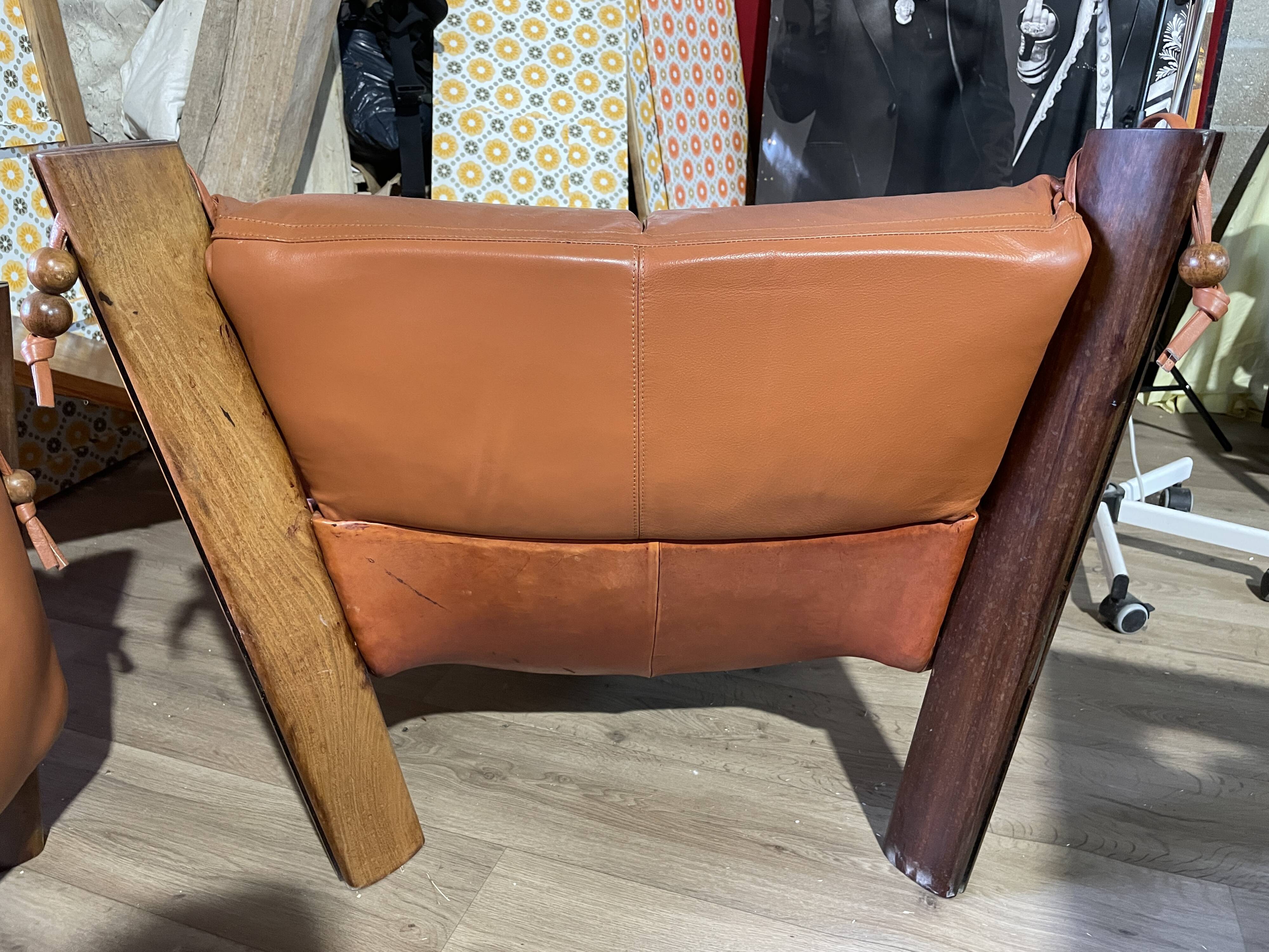 Percival lafer mp-211 sofa set with two armchairs and an ottoman in leather.