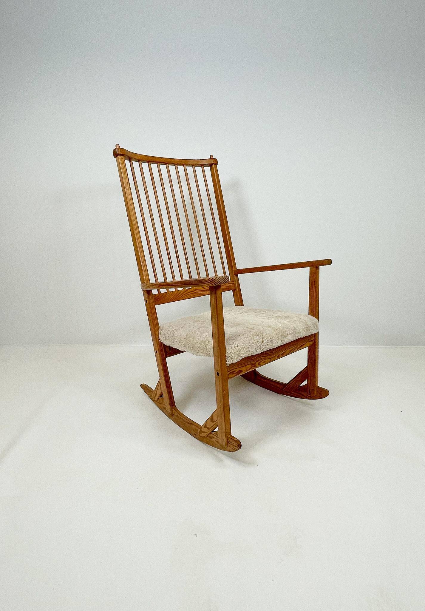 Mid-century rocking chair in pine and sheepskin by Yngve Ekström, Sweden.
