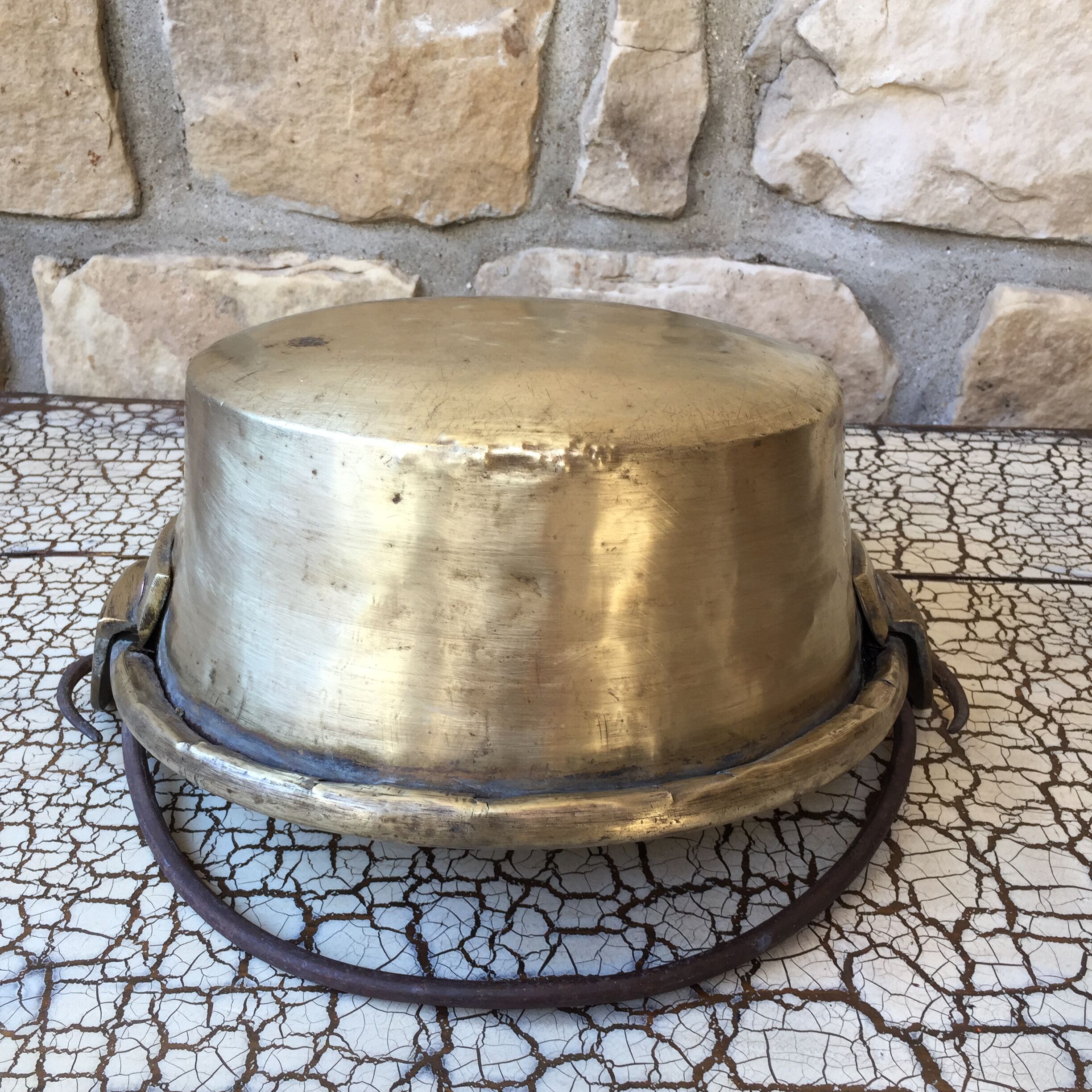 Basin cauldron or old garden in yellow copper