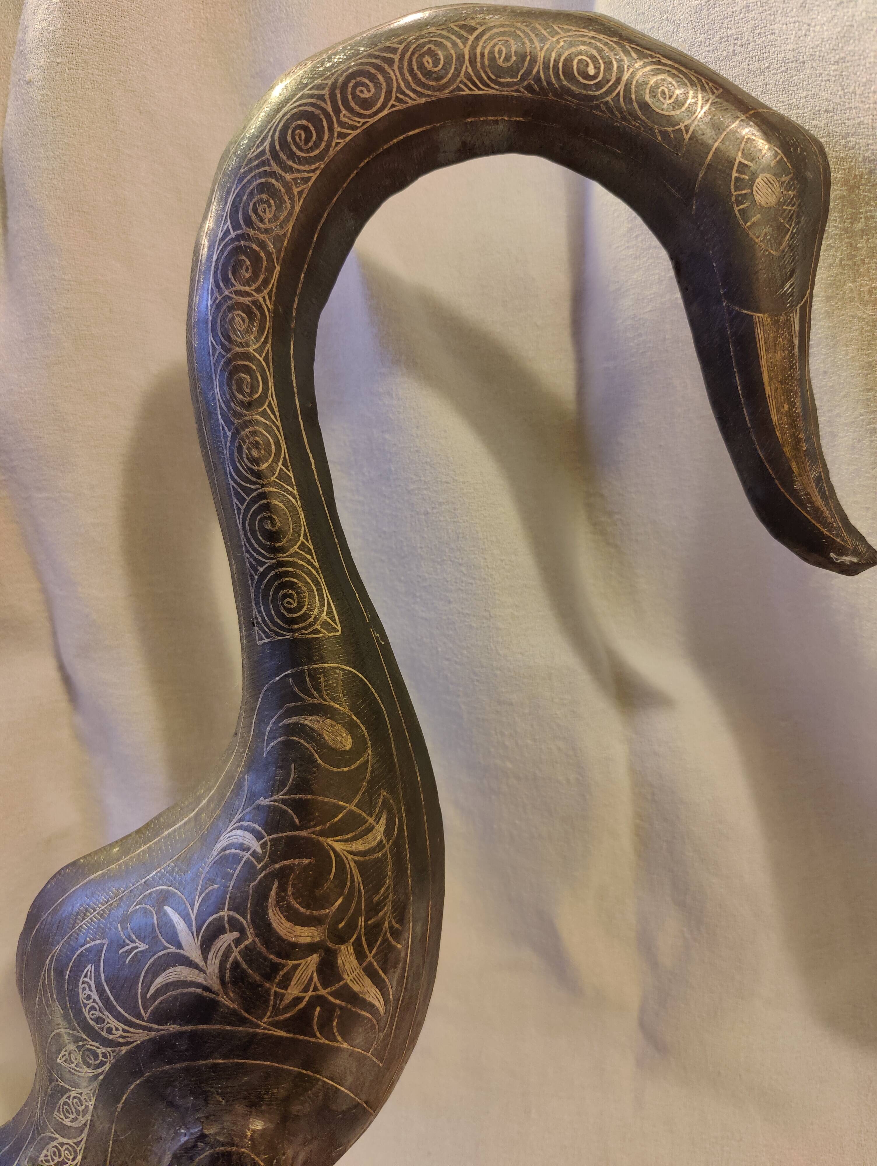 Damascened metal bird sculpture