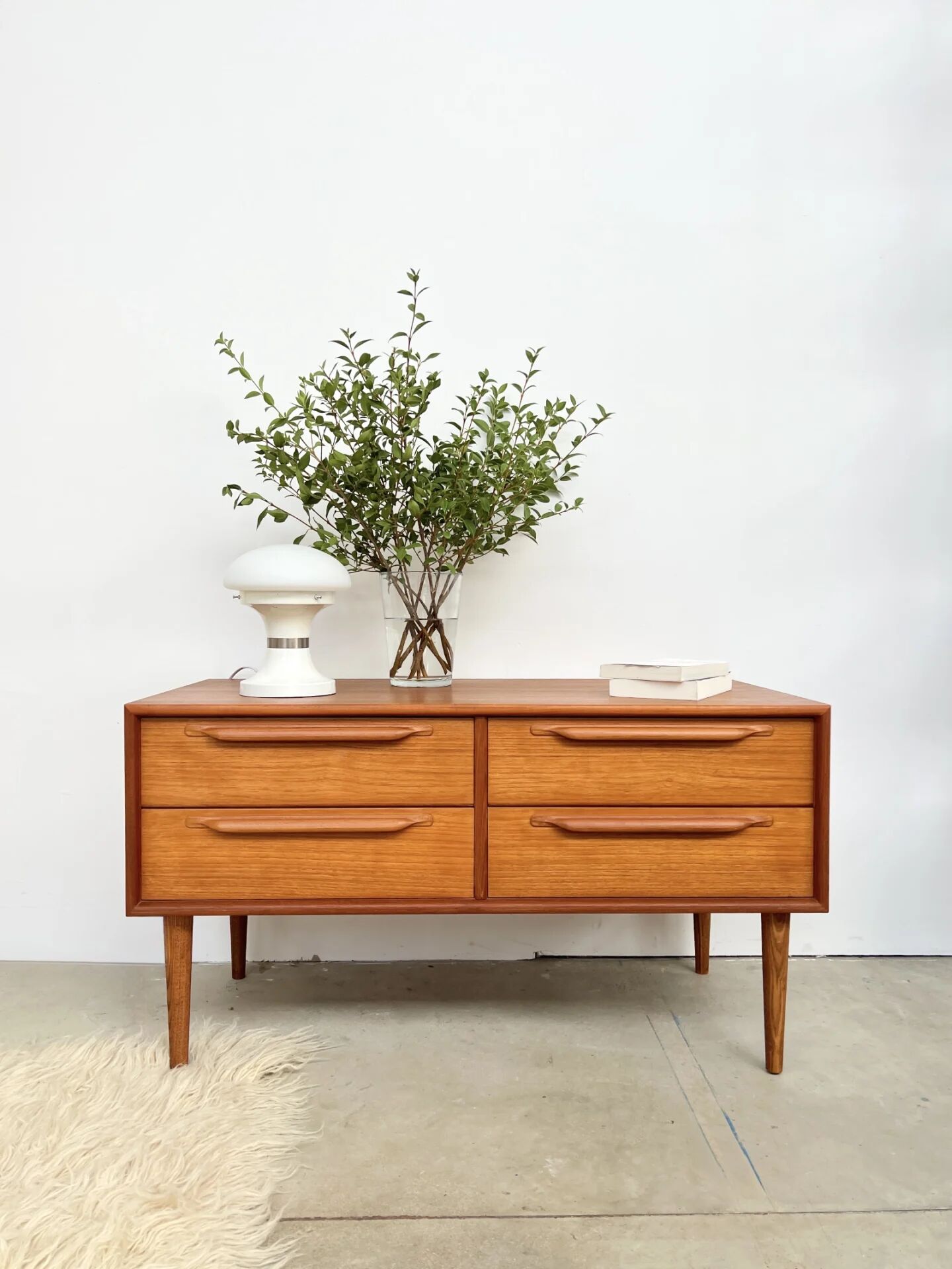 Lowboard teak 4 drawers — Mid-century lines, tapered legs, 1960s