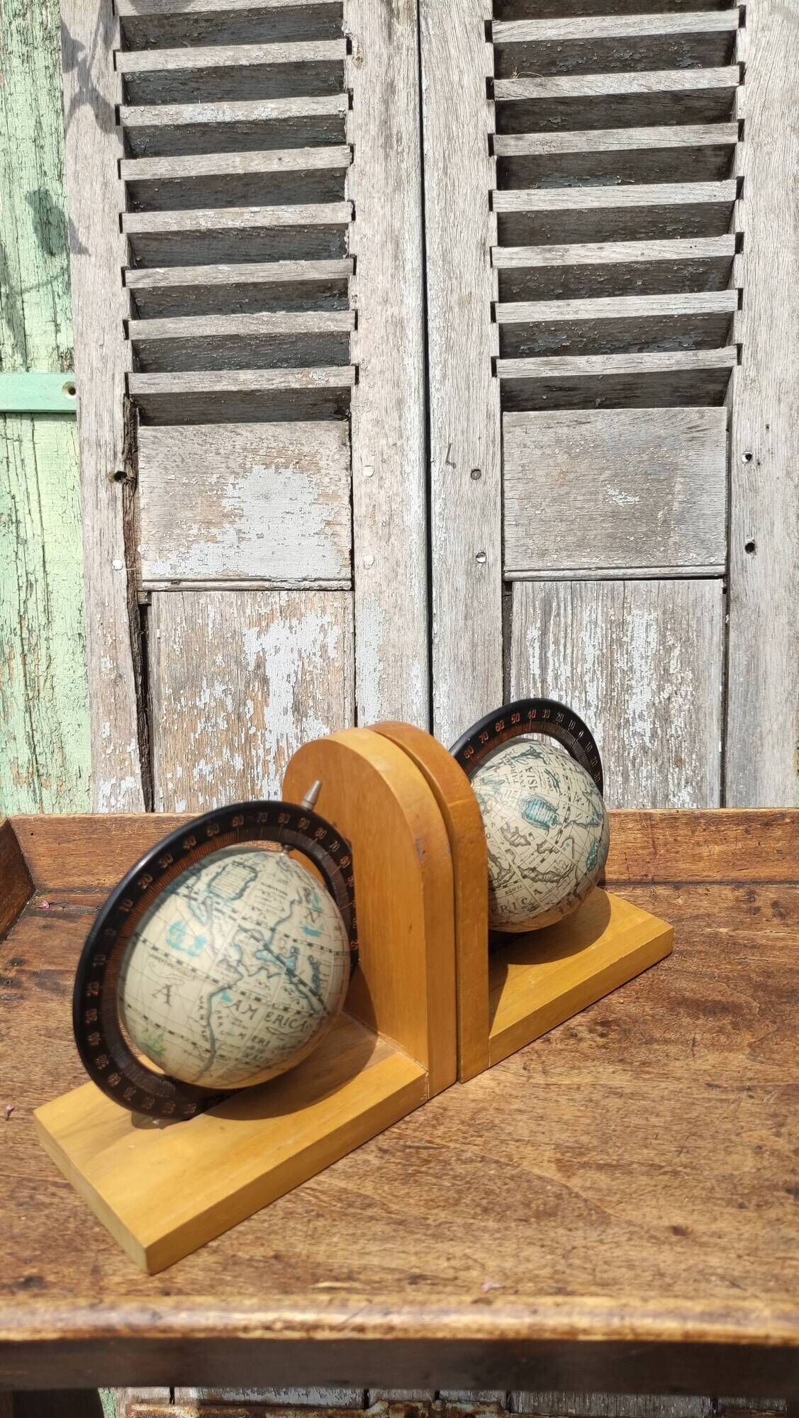 Pair of greenhouses vintage wooden books world map