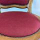 Vintage captain's chair in wood and garnet fabric — a seat with character