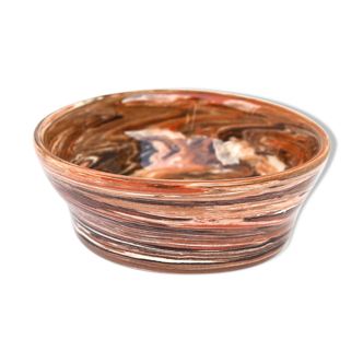 Terracotta cup in mixed earth