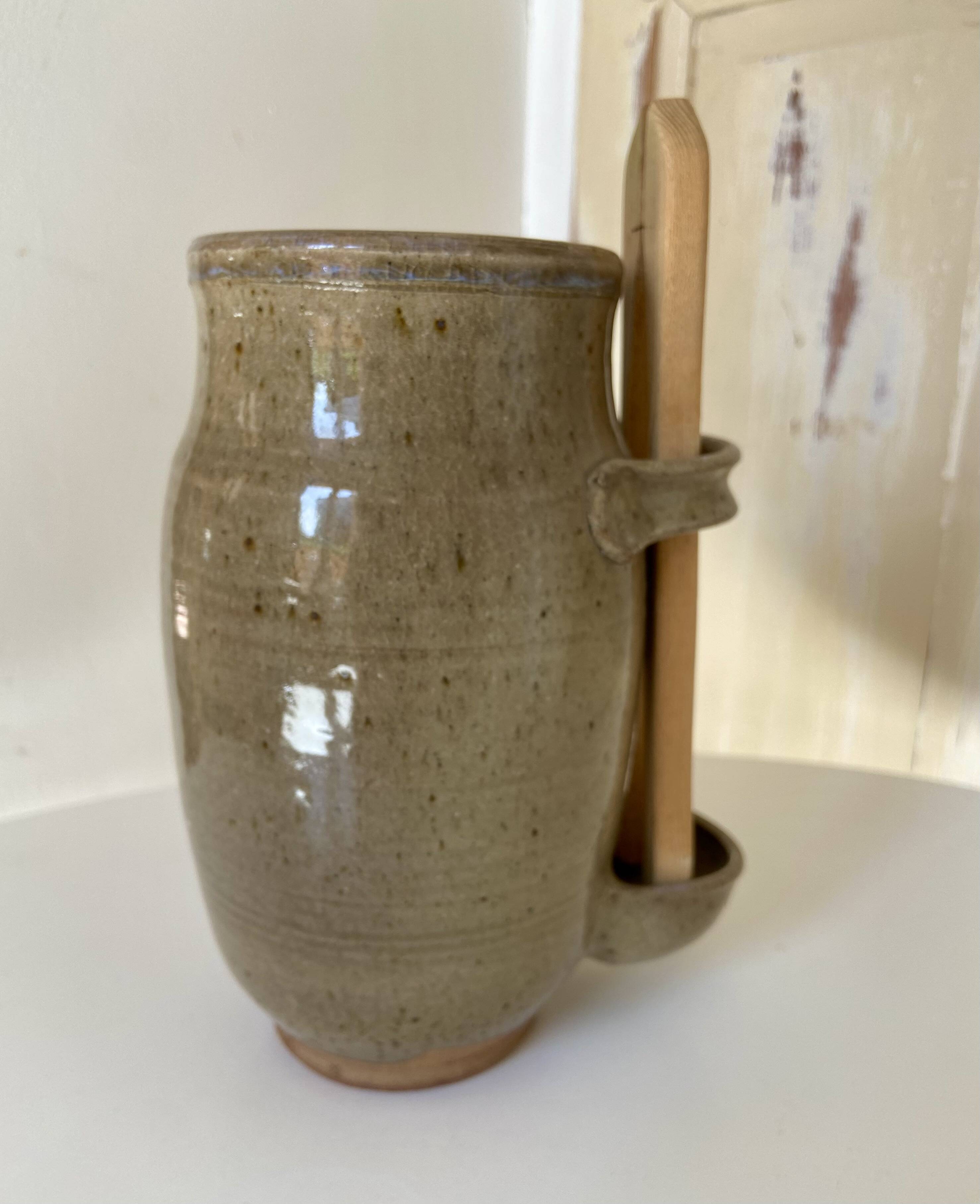 Old varnished stoneware pickle pot with tongs