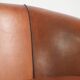 Sheepskin 2-seater sofa with a warm cognac brown colour scheme