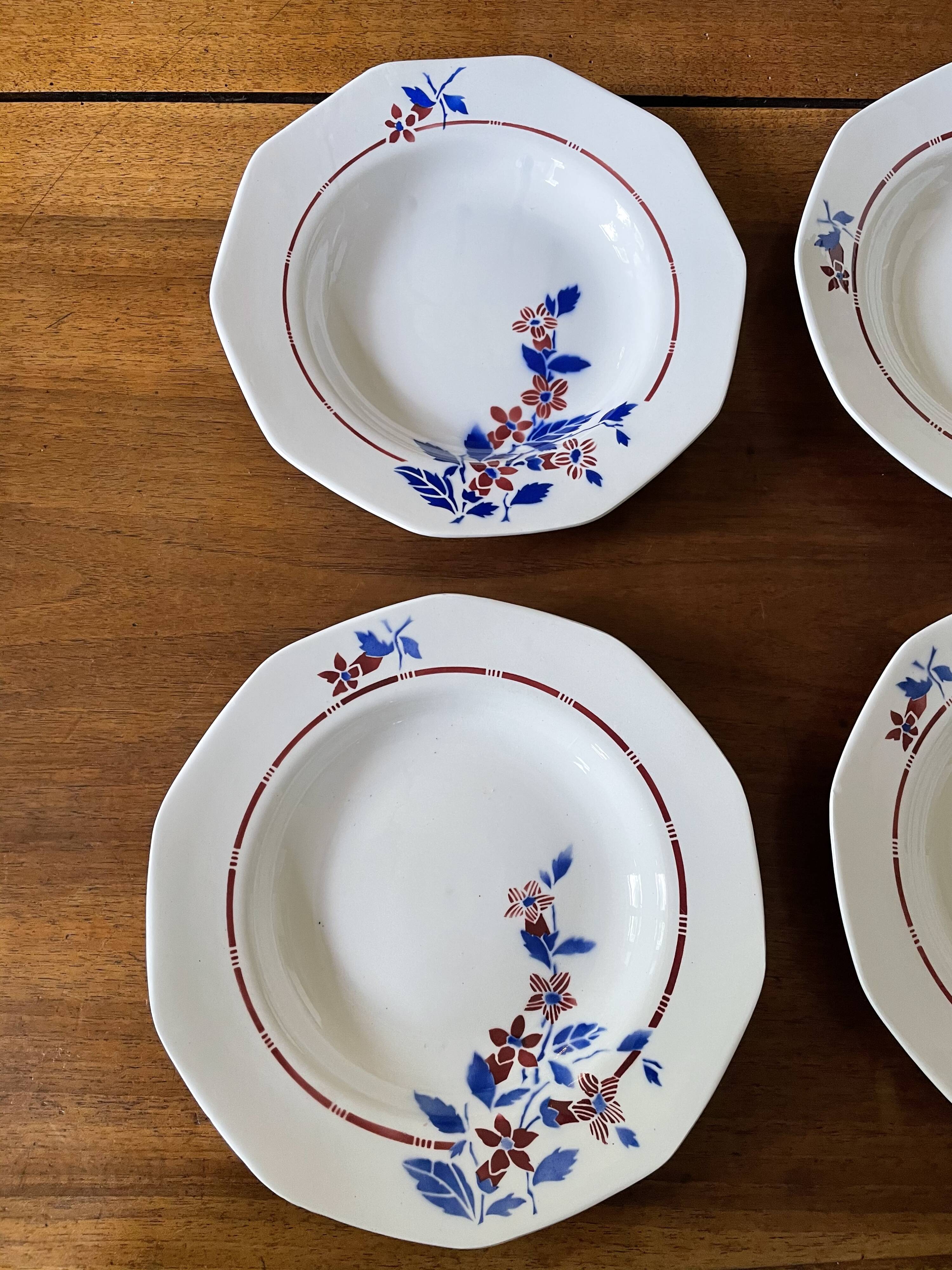Saint Amand hollow plates decorated with red and blue flowers