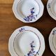 Saint Amand hollow plates decorated with red and blue flowers