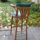 Bar stool in green leather and curved wood