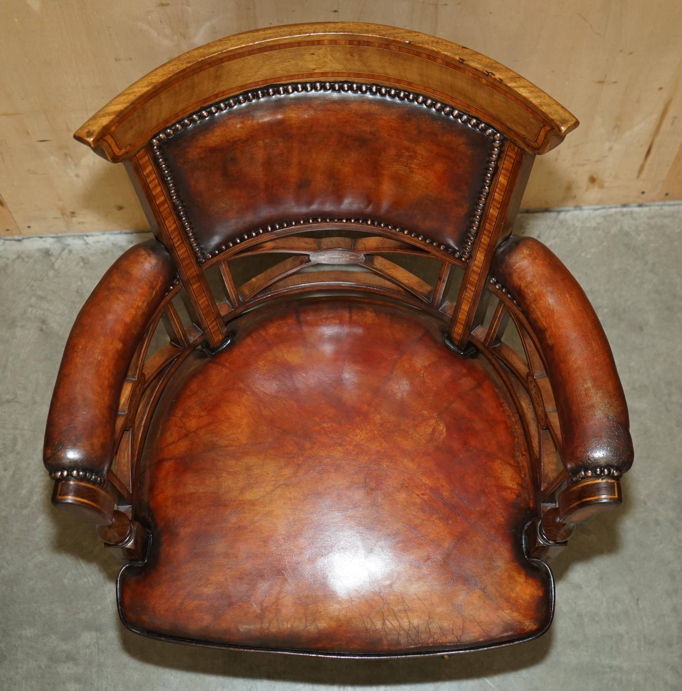 Victorian captain's chair in leather restored by Cornelius V Smith.