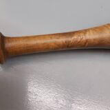 Imposing ancient ceramic pestle and wood