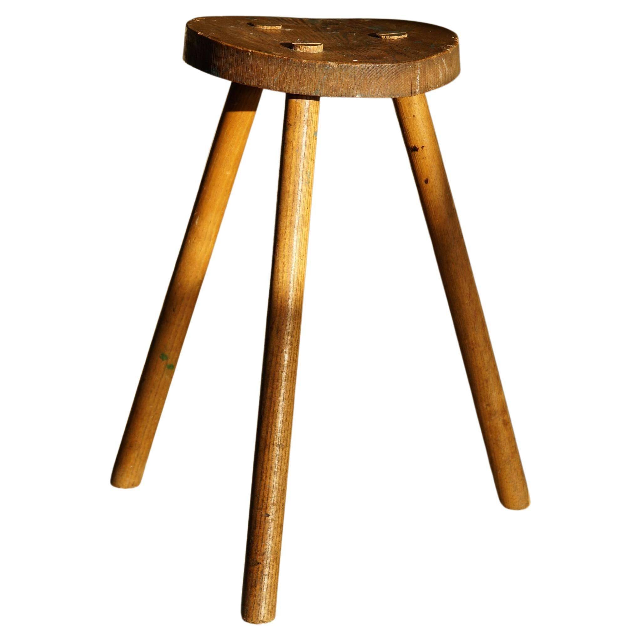 Tripod stool made of solid oak, by a Danish cabinetmaker, mid-century, around 1960.