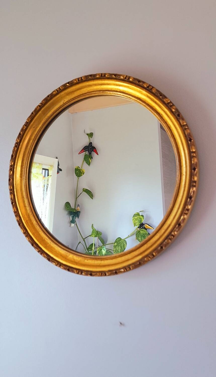 Round golden mirror, 1970.