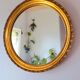 Round golden mirror, 1970.