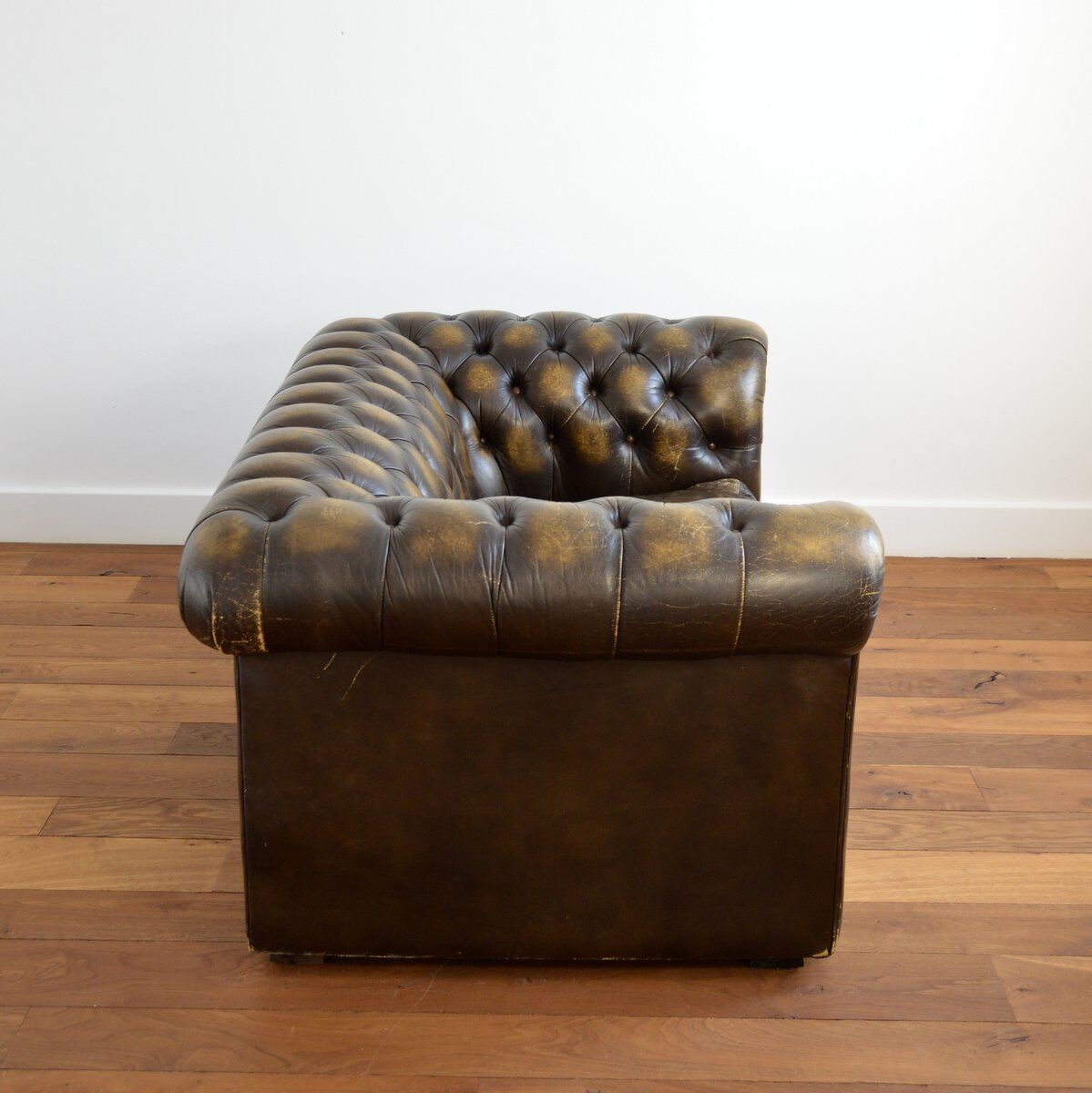 Vintage two-seater leather Chesterfield sofa