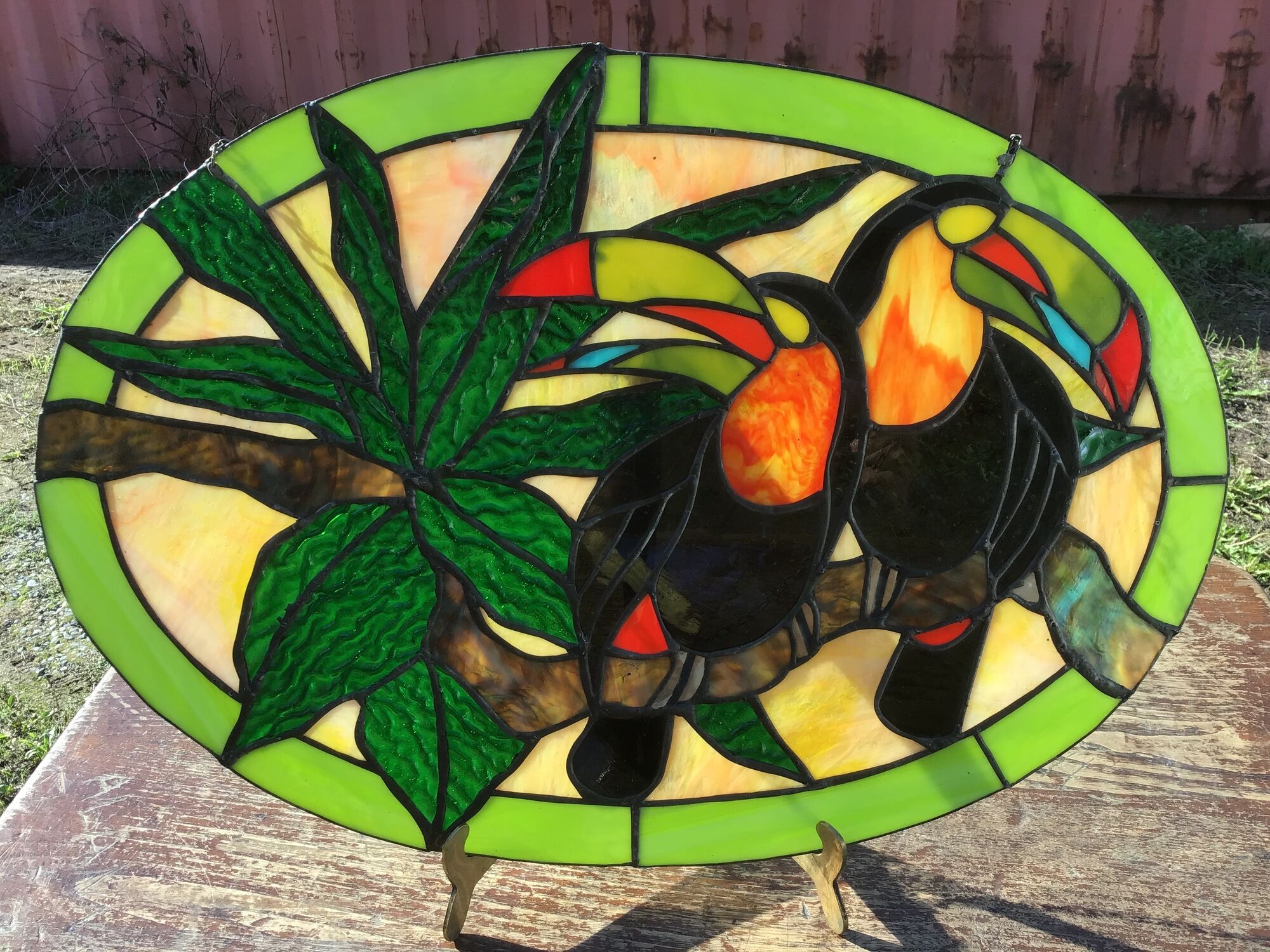 Art Deco style stained glass window representing a couple of toucans
