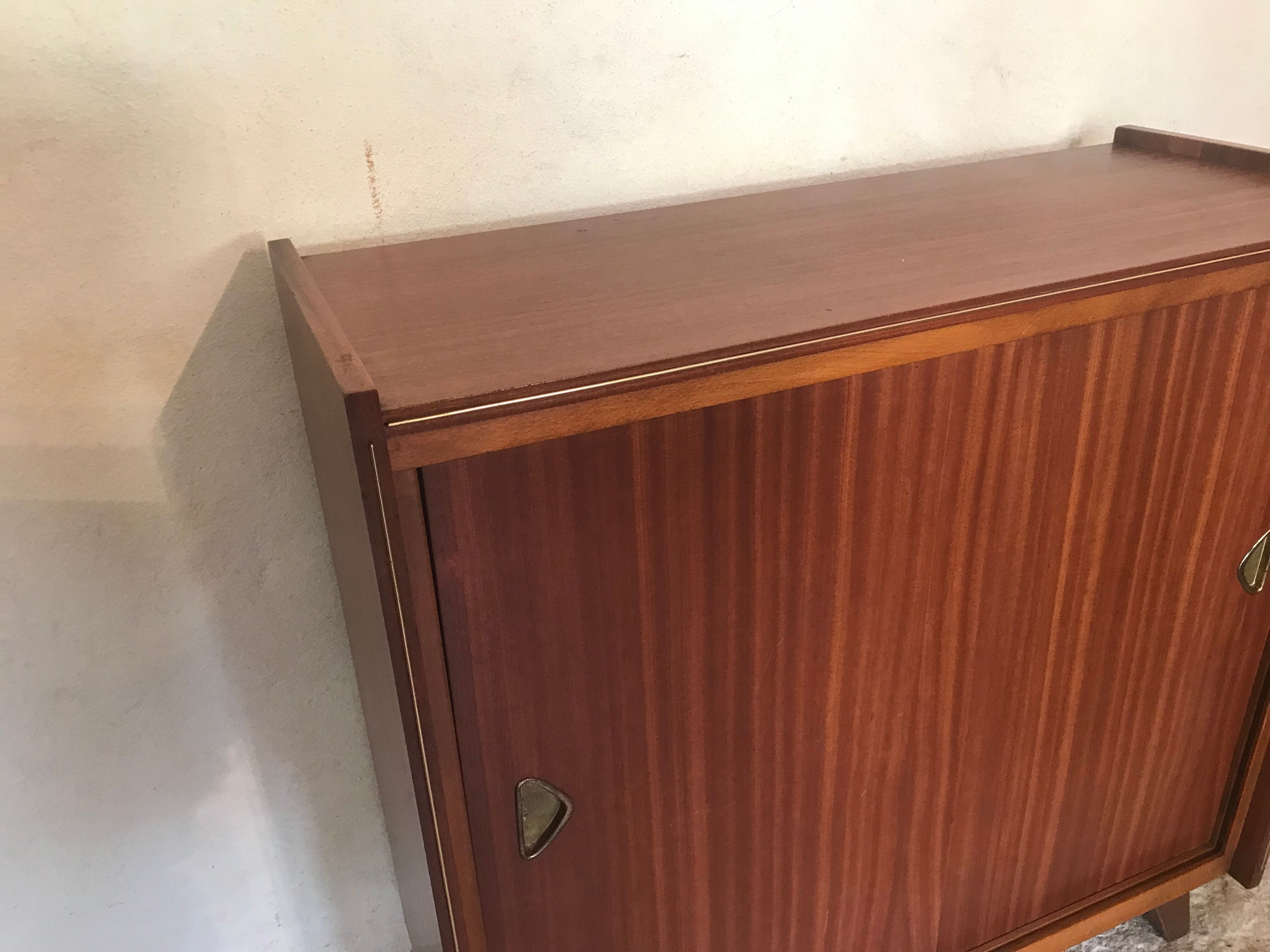 Vintage storage cabinet teak veneer sliding door compass feet